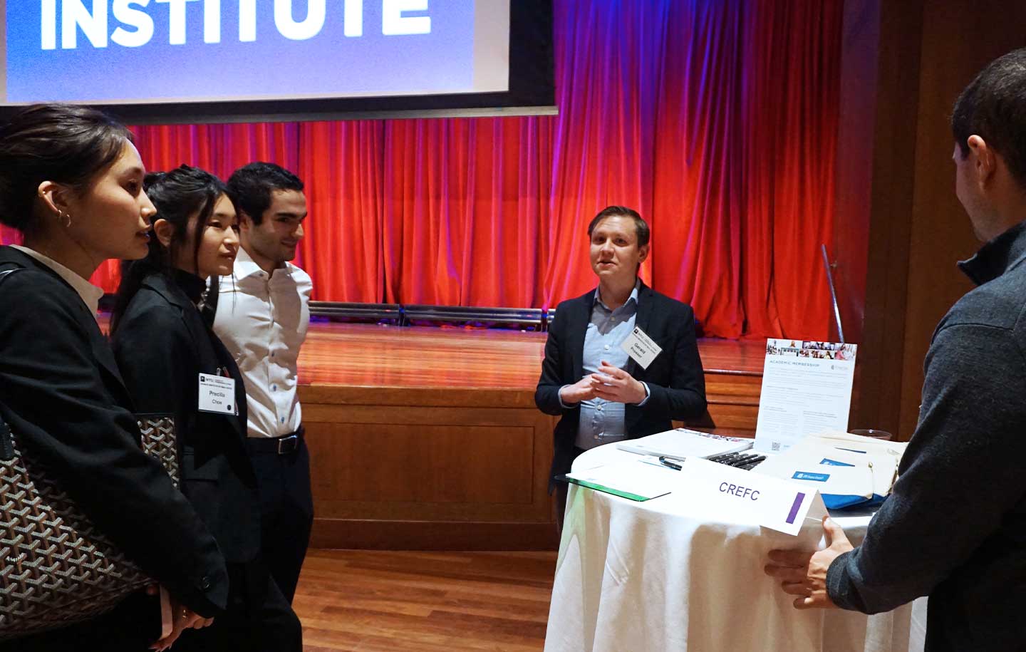 Two male NYU SPS students engage in a discussion.